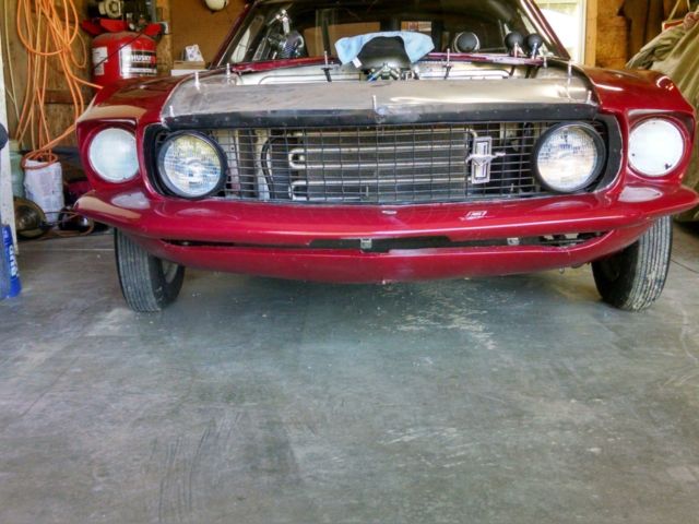 1969 Burgundy Ford Mustang Fastback