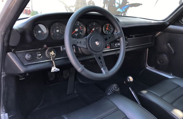 1969 Silver Porsche 911 Coupe convertable