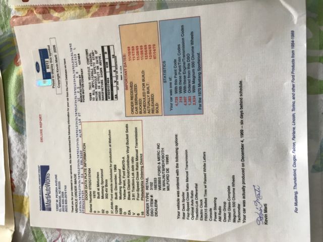 1970 yellow and black Ford Mustang Coupe