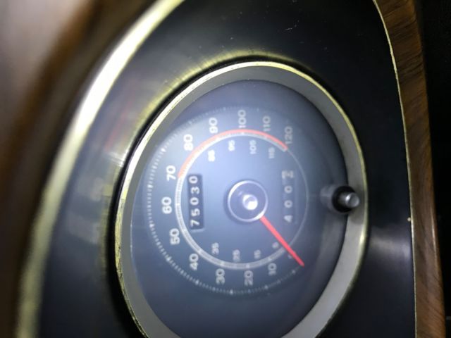 1970 yellow and black Ford Mustang Coupe