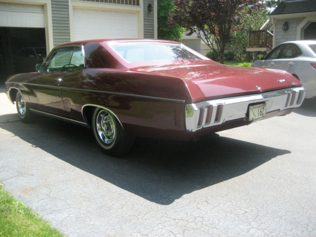 1970 black cherry Chevrolet Impala Coupe