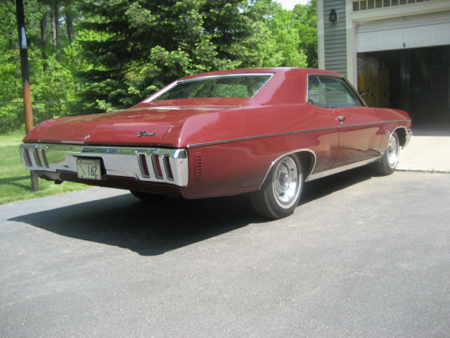 1970 black cherry Chevrolet Impala Coupe