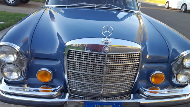 1971 White Mercedes-Benz 200-Series Sedan