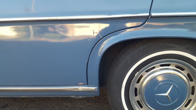 1971 White Mercedes-Benz 200-Series Sedan