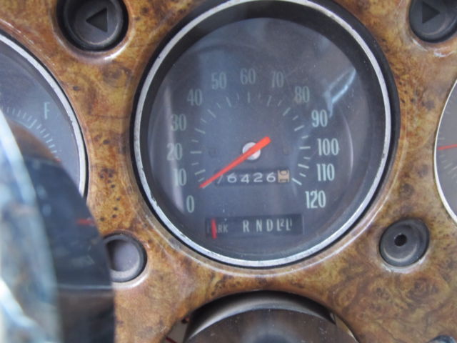 1970 gold and cream Chevrolet Monte Carlo Coupe