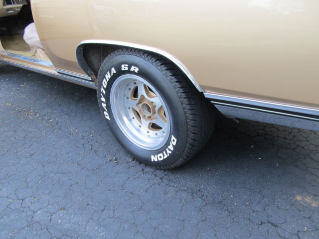 1970 gold and cream Chevrolet Monte Carlo Coupe