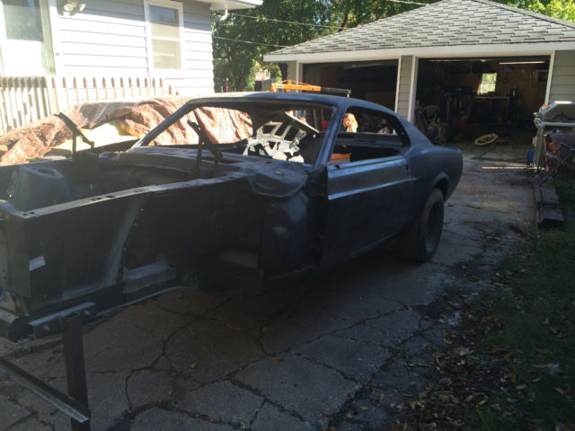 1970 primer Ford Mustang fastback
