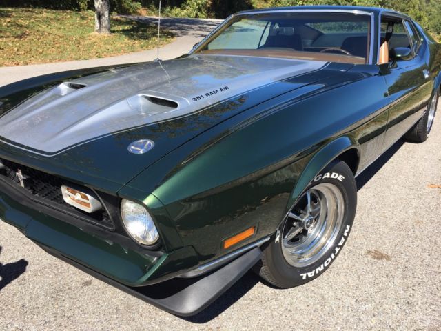 1971 green and silver Ford Mustang fastback