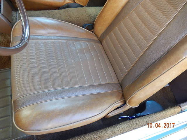 1971 green and silver Ford Mustang fastback