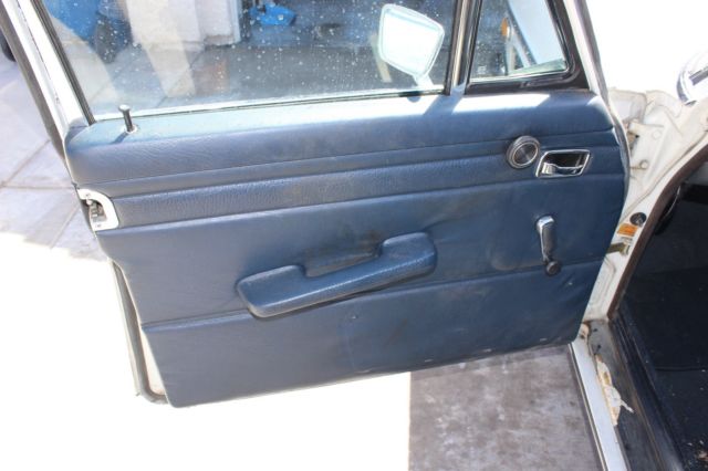 1971 White Mercedes-Benz 200-Series Sedan