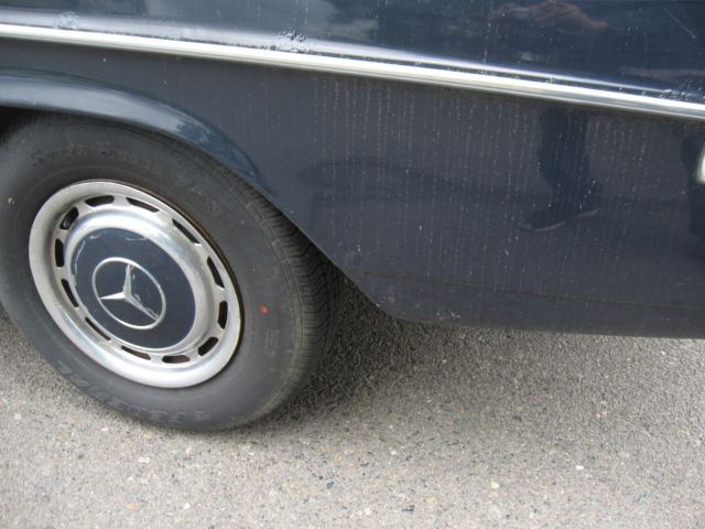 1971 White Mercedes-Benz 200-Series Sedan