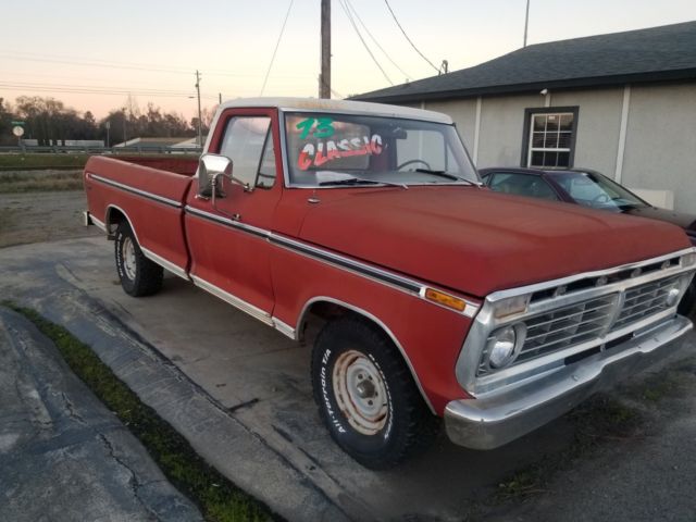 1973 red Ford F-100 Standard Cab Pickup