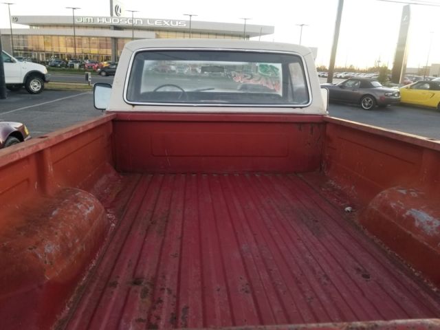 1973 red Ford F-100 Standard Cab Pickup