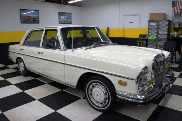 1973 White Mercedes-Benz 200-Series Sedan