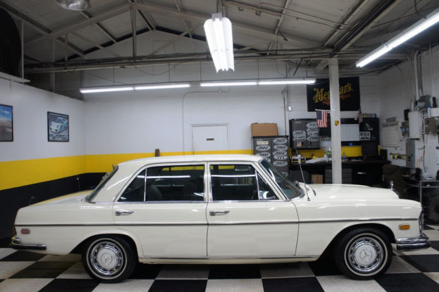 1973 White Mercedes-Benz 200-Series Sedan