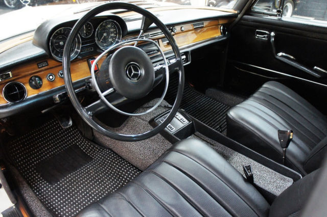 1973 White Mercedes-Benz 200-Series Sedan