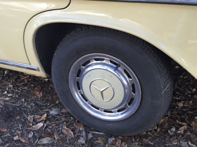 1973 Yellow Mercedes-Benz 200-Series Sedan