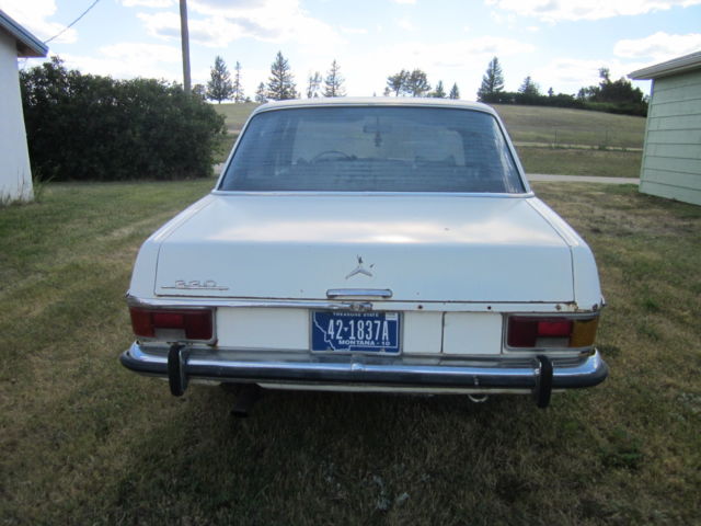 1973 White Mercedes-Benz 200-Series Sedan