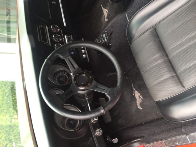 1973 red Ford Mustang Convertible