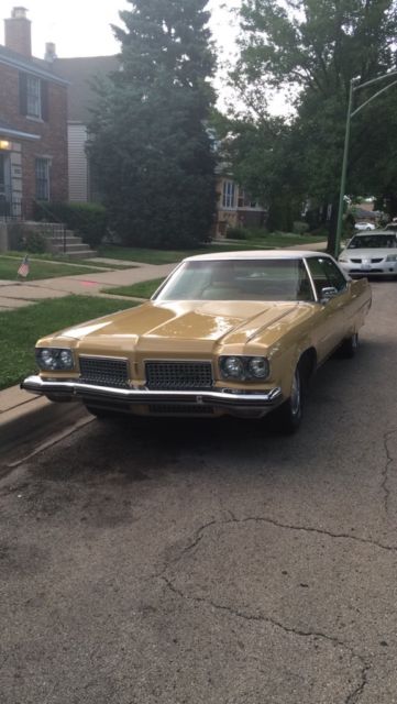 1973 Red Oldsmobile Ninety-Eight Sedan