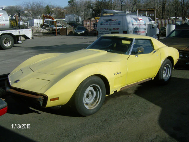 1974 yellow Chevrolet Corvette 2 door coupe