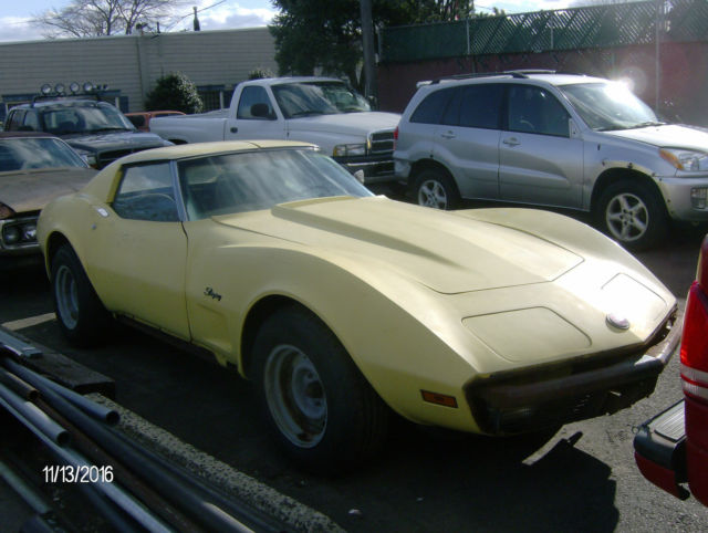1974 yellow Chevrolet Corvette 2 door coupe