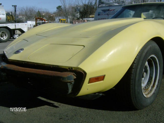 1974 yellow Chevrolet Corvette 2 door coupe