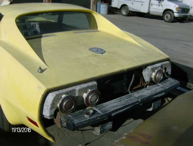 1974 yellow Chevrolet Corvette 2 door coupe