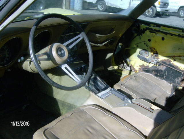 1974 yellow Chevrolet Corvette 2 door coupe