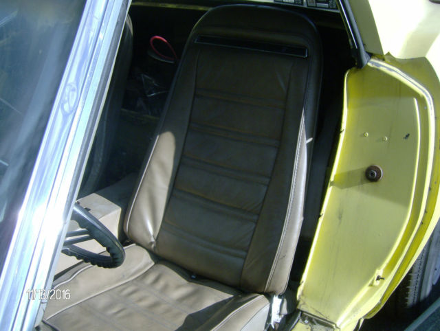 1974 yellow Chevrolet Corvette 2 door coupe