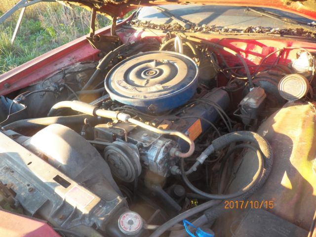 1974 Red with woodgrain Ford Country Squire Wagon