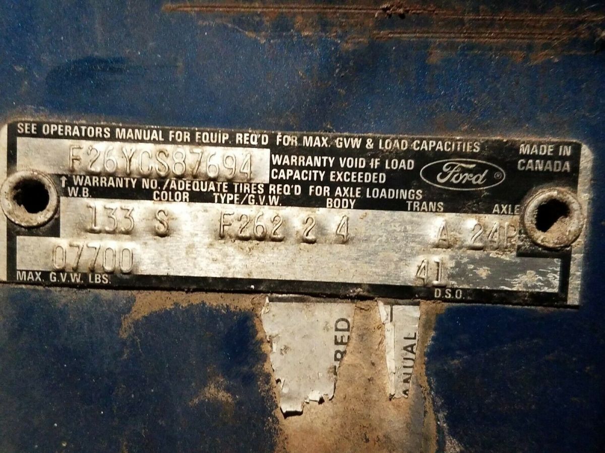 1974 Blue Ford F-250 pickup truck w capped bed