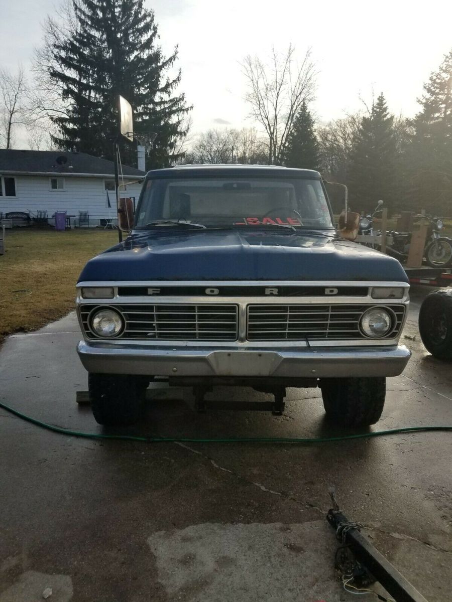 1974 Blue Ford F-250 pickup truck w capped bed