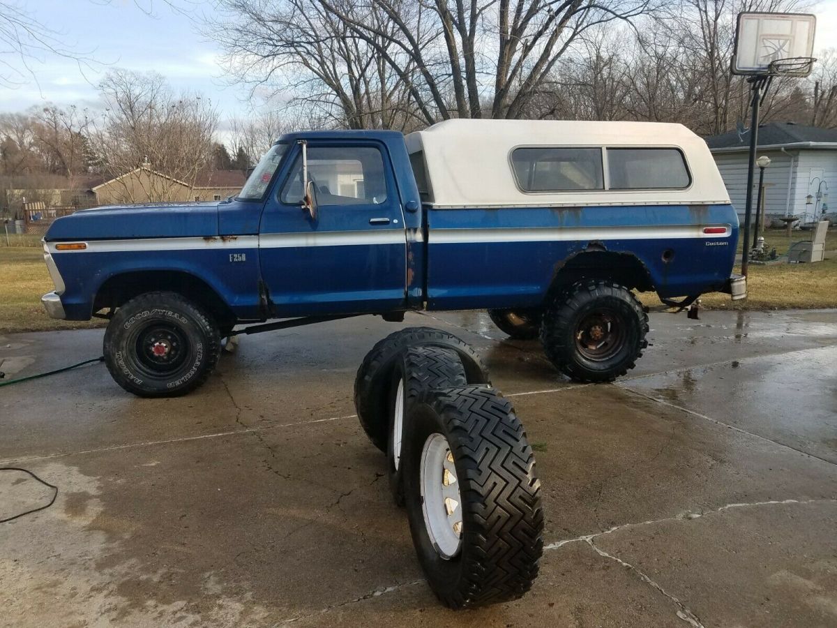 1974 Blue Ford F-250 pickup truck w capped bed