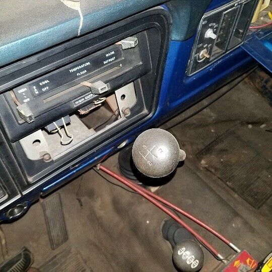 1974 Blue Ford F-250 pickup truck w capped bed