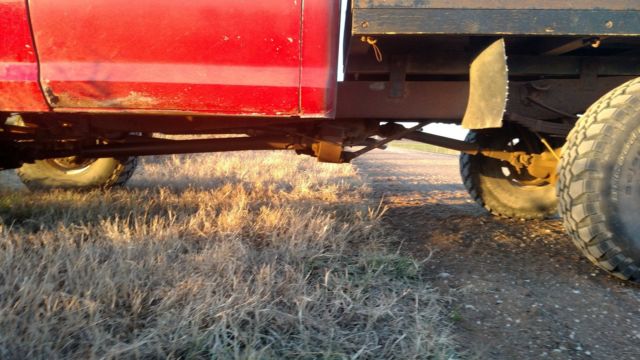 1975 red/white Ford F-250 truck