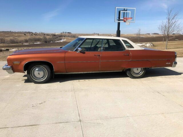 1975 Orange Oldsmobile Ninety-Eight Sedan