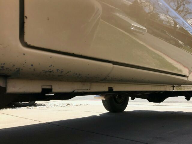 1976 beige Ford E-Series Van