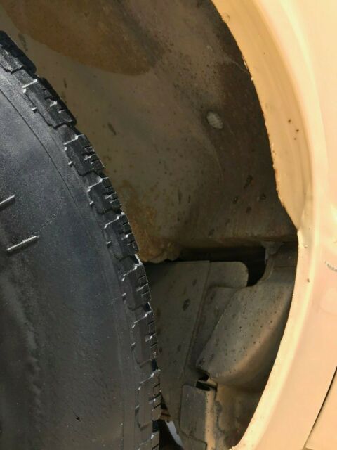 1976 beige Ford E-Series Van