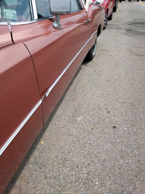 1976 Orange Cadillac Eldorado Coupe