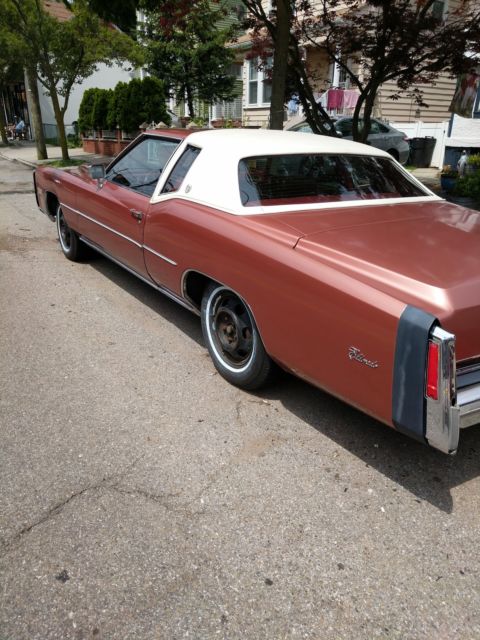 1976 Orange Cadillac Eldorado Coupe