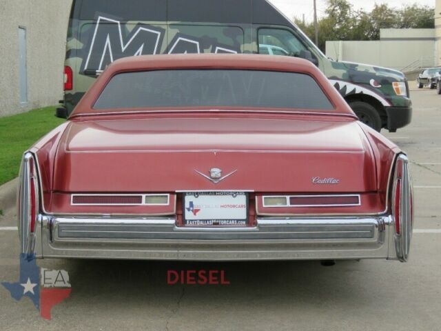 1976 Red Cadillac DeVille Coupe