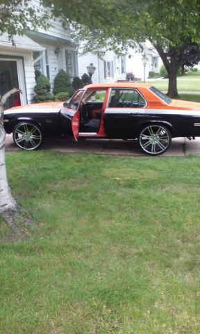 1976 Orange, Gray, & Black Chevrolet Nova Sedan