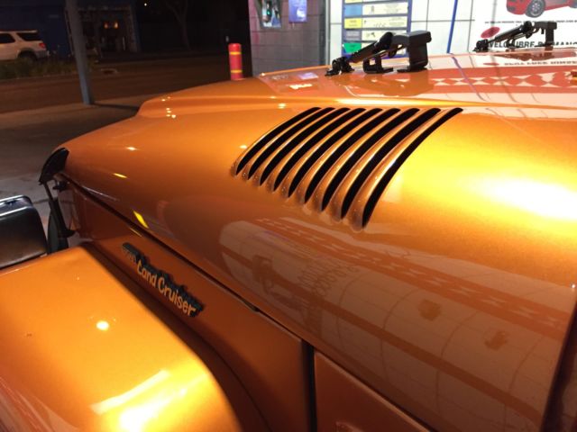 1976  Tricolor atomic orange pearlescent metallic paint Toyota Land Cruiser  Two door hardtop coupe w/ removable shell