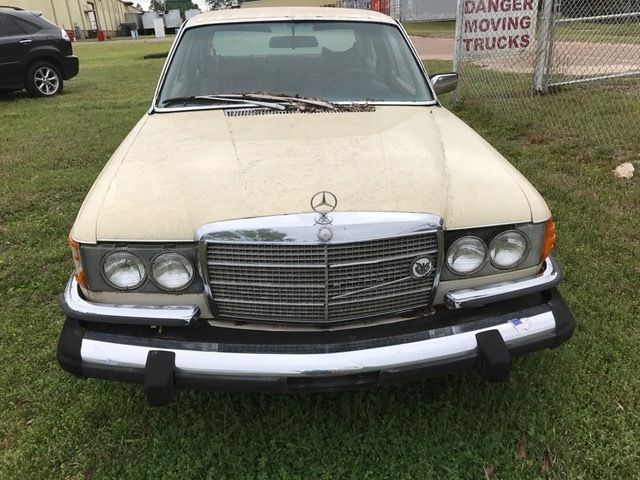 1976 Gold Mercedes-Benz 200-Series sedan