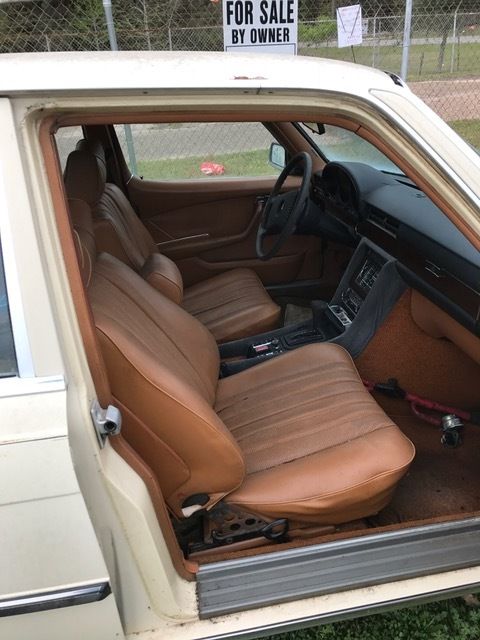 1976 Gold Mercedes-Benz 200-Series sedan