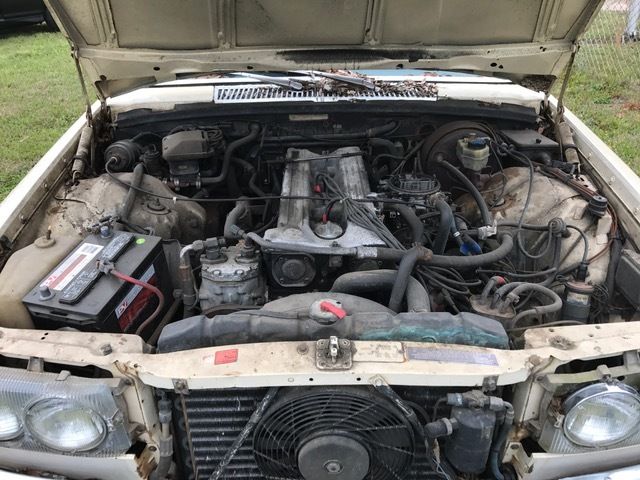 1976 Gold Mercedes-Benz 200-Series sedan