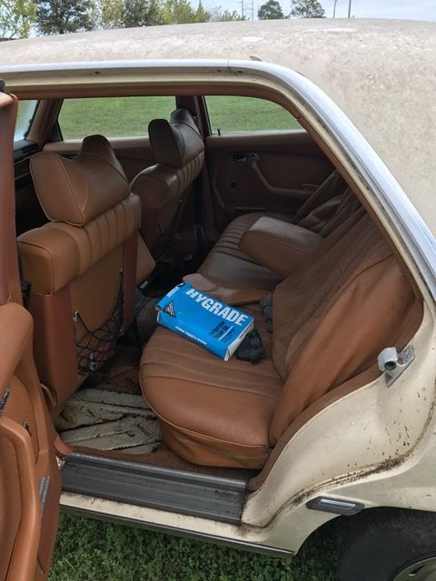 1976 Gold Mercedes-Benz 200-Series sedan