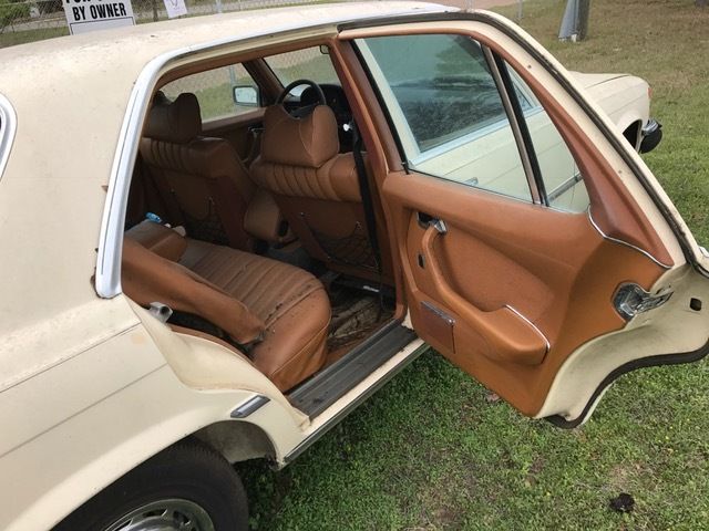 1976 Gold Mercedes-Benz 200-Series sedan