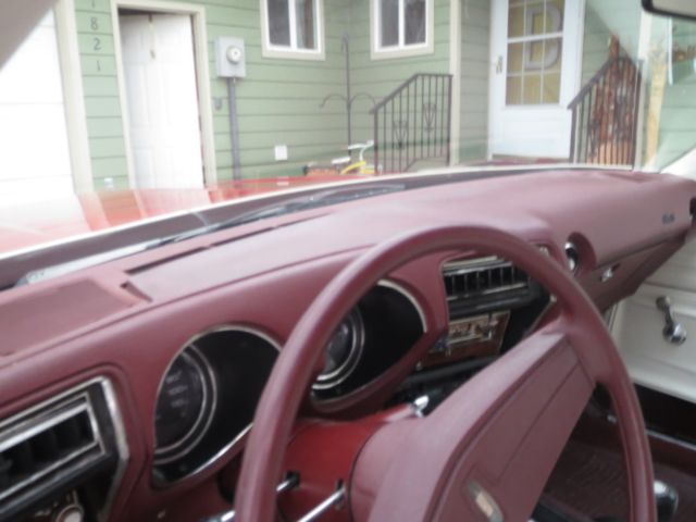 1976 Red Oldsmobile Cutlass Coupe